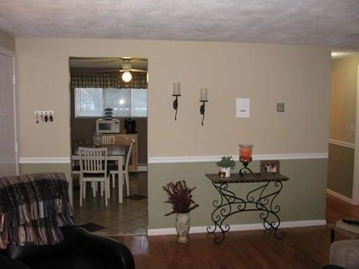 living room featuring hardwood / wood-style floors and a textured ceiling