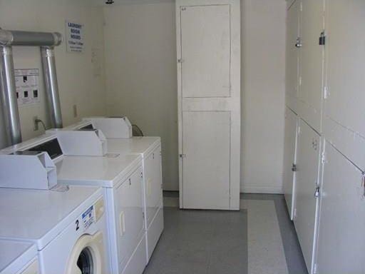 clothes washing area featuring washer and clothes dryer