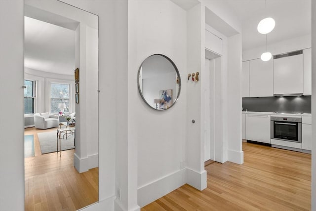 hall with light wood-type flooring