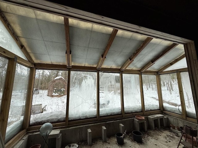 sunroom / solarium featuring lofted ceiling