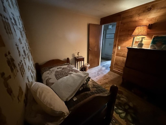 bedroom with wooden walls