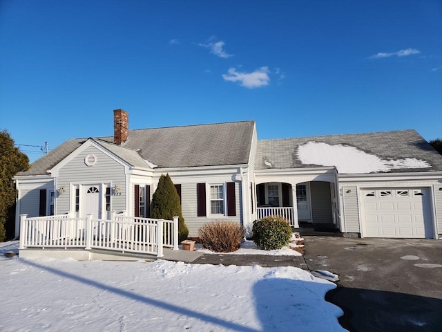 view of front of house featuring a garage and covered porch