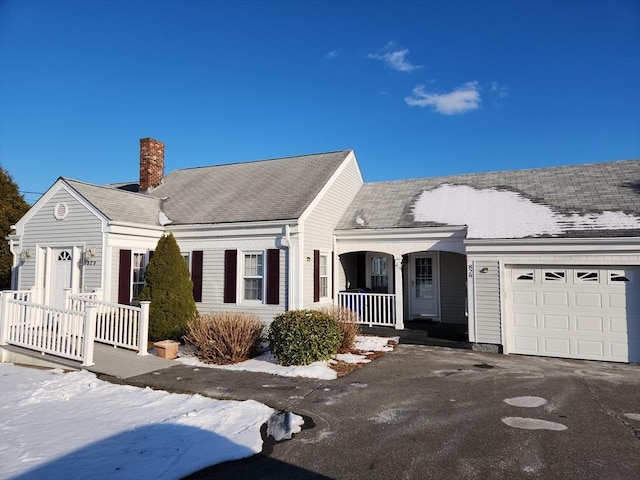 view of front of house featuring a garage and covered porch