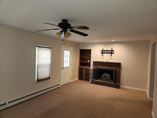 unfurnished living room featuring a brick fireplace, carpet, ceiling fan, and baseboard heating