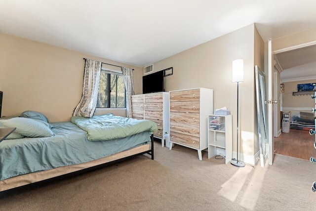 bedroom featuring carpet flooring and visible vents