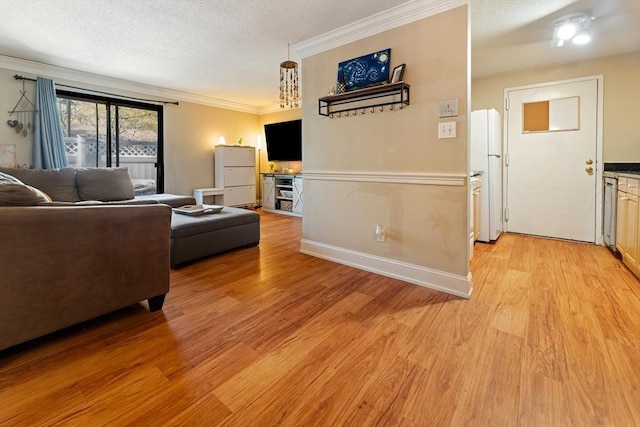 living area featuring a textured ceiling, ornamental molding, baseboards, and light wood-style flooring