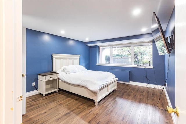 bedroom featuring dark hardwood / wood-style floors