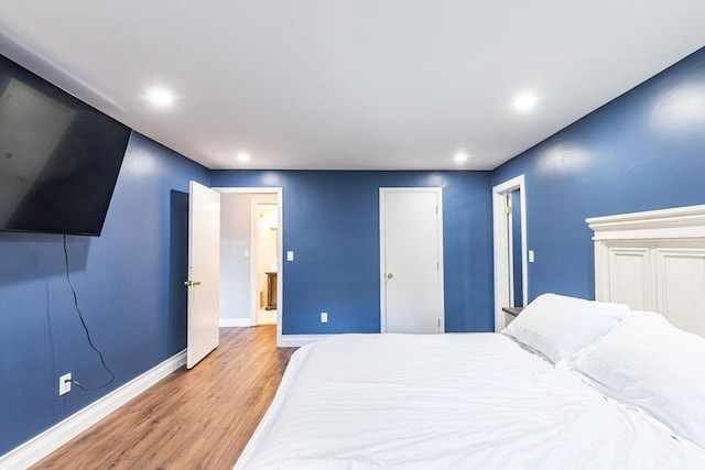 bedroom featuring hardwood / wood-style floors