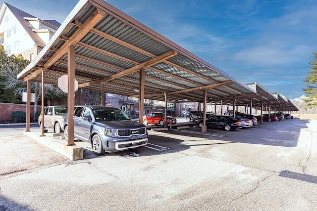 view of vehicle parking with a carport