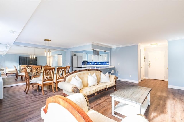 living room featuring hardwood / wood-style flooring and ornamental molding