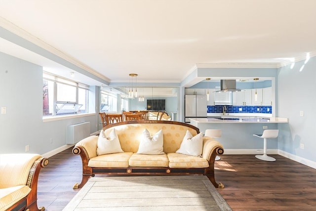 living room featuring hardwood / wood-style floors and ornamental molding