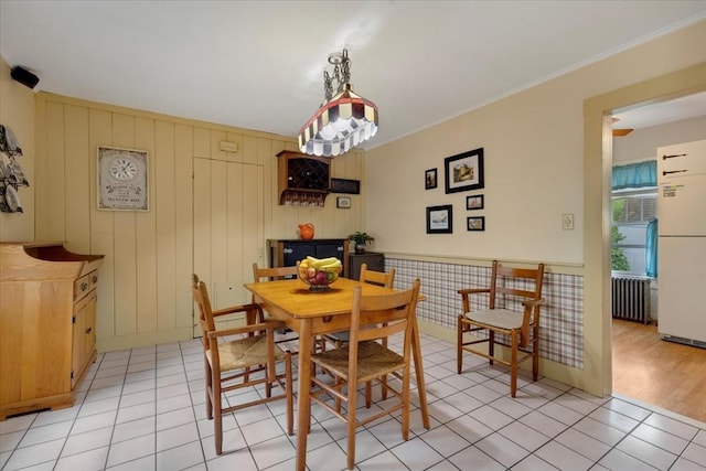 14 Cottage St, Whitman, MA 02382 - dining room featuring light tile patterned flooring, radiator heating unit, and ornamental molding