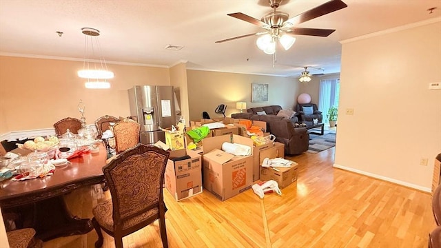 13 Dallas Dr Unit 308, Dracut, MA 01826 - dining area with light wood-style flooring, ornamental molding, and a ceiling fan