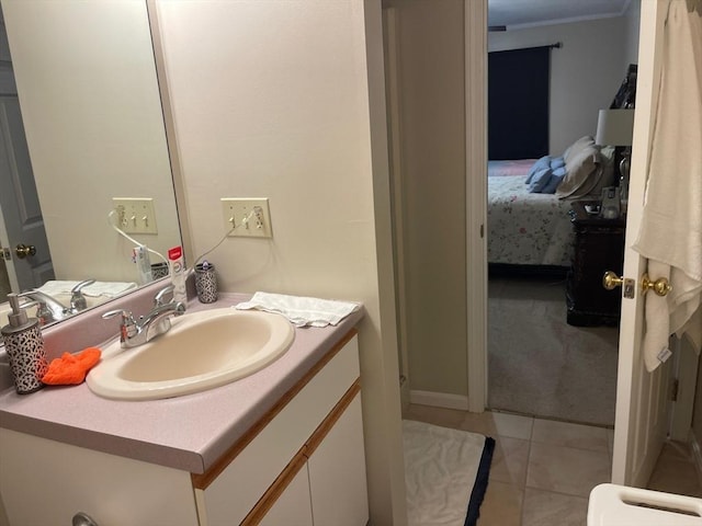 13 Dallas Dr Unit 308, Dracut, MA 01826 - bathroom with vanity, connected bathroom, tile patterned floors, and ornamental molding