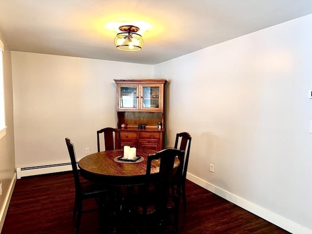 dining room with a baseboard radiator and dark hardwood / wood-style flooring