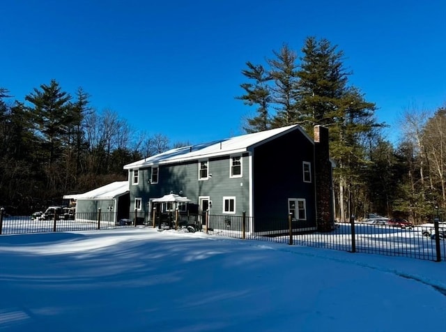 view of snow covered house