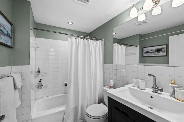 34 Beacon St Unit 3, Chelsea, MA 02150 - bathroom with tile walls, vanity, and shower / bath combo with shower curtain