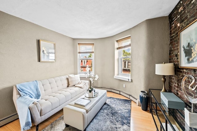 34 Beacon St Unit 3, Chelsea, MA 02150 - living area featuring a baseboard radiator, wood finished floors, and a textured wall