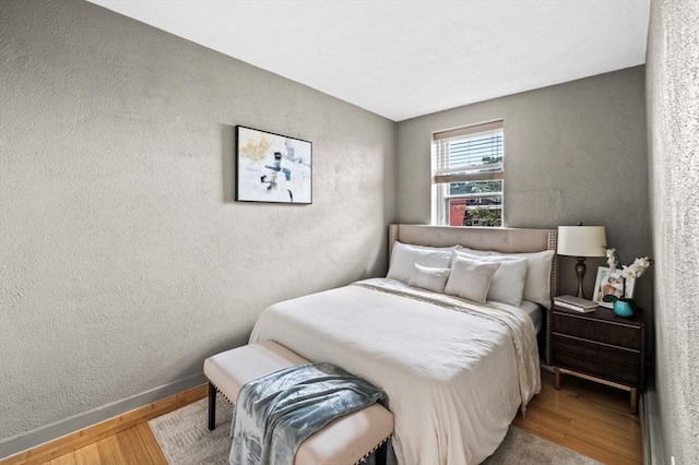 34 Beacon St Unit 3, Chelsea, MA 02150 - bedroom featuring wood finished floors and a textured wall