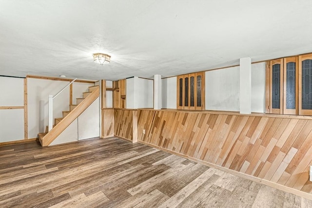 191 Franklin St Unit A, Stoneham, MA 02180 - finished basement featuring wood finished floors and stairs