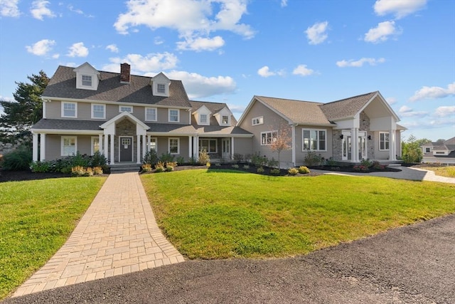 47 Spring St, Rehoboth, MA 02769 - view of front of home with a chimney, a front yard, and covered porch