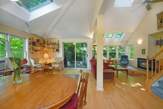 4 Half Moon Hl Unit 4, Acton, MA 01720 - dining room featuring a skylight, healthy amount of natural light, high vaulted ceiling, wood finished floors, and a ceiling fan