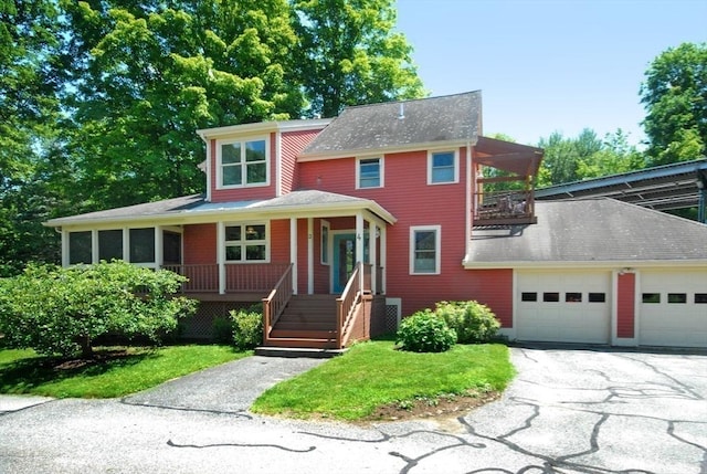 4 Half Moon Hl Unit 4, Acton, MA 01720 - view of front facade with covered porch, a balcony, driveway, a garage, and roof with shingles