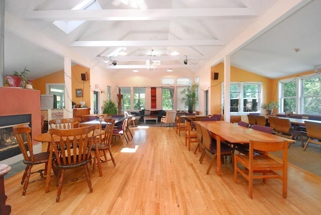 4 Half Moon Hl Unit 4, Acton, MA 01720 - dining area with light wood-type flooring, a multi sided fireplace, and a skylight