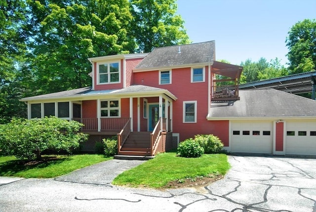 4 Half Moon Hl Unit 4, Acton, MA 01720 - view of front facade with covered porch, a balcony, asphalt driveway, an attached garage, and a shingled roof