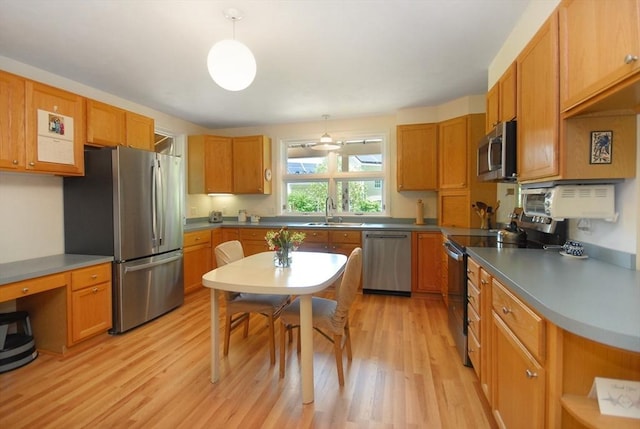 4 Half Moon Hl Unit 4, Acton, MA 01720 - kitchen featuring stainless steel appliances, light wood-type flooring, decorative light fixtures, open shelves, and brown cabinets