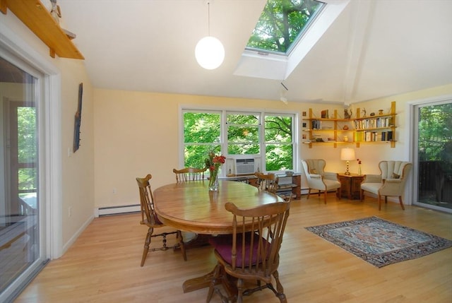 4 Half Moon Hl Unit 4, Acton, MA 01720 - dining area featuring a baseboard heating unit, light wood finished floors, a skylight, cooling unit, and vaulted ceiling