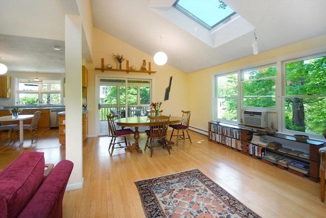 4 Half Moon Hl Unit 4, Acton, MA 01720 - dining room with a skylight, light wood finished floors, lofted ceiling, a baseboard heating unit, and cooling unit