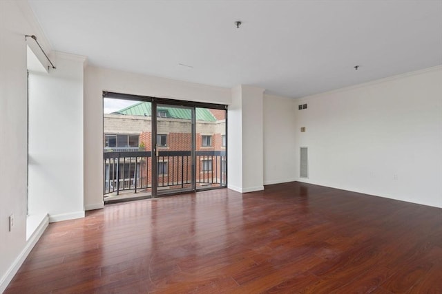 unfurnished room with crown molding and dark hardwood / wood-style floors