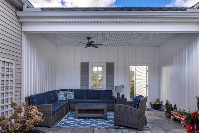 living room featuring wooden walls, beamed ceiling, and ceiling fan