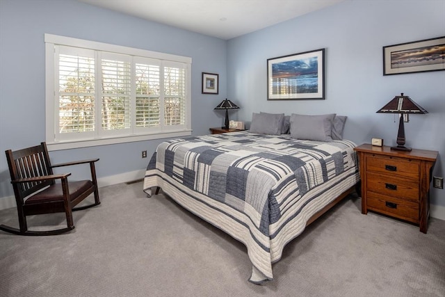 bedroom with light carpet