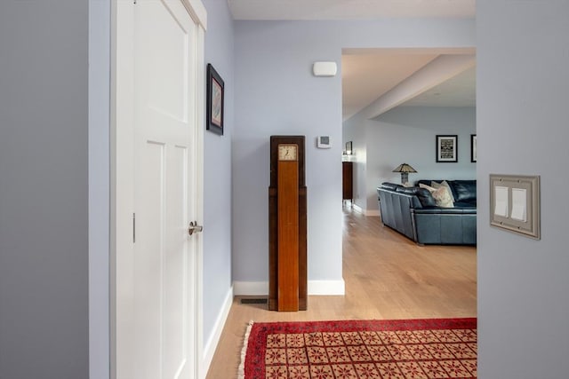 corridor with wood-type flooring