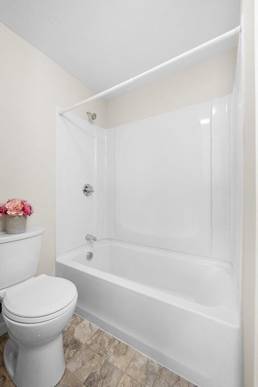 full bath featuring toilet and bathing tub / shower combination