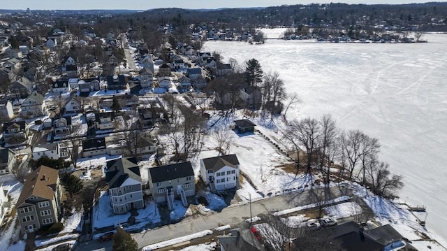 snowy aerial view featuring a residential view