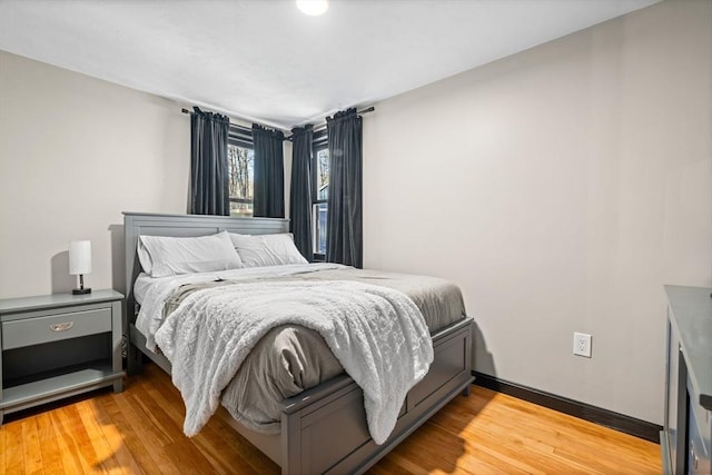 bedroom with light wood finished floors