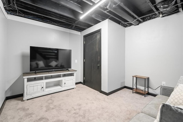 carpeted living room with baseboards