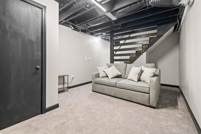 living area featuring carpet, stairway, and baseboards