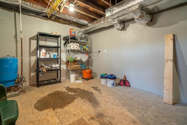 unfinished below grade area with a water pressure tank