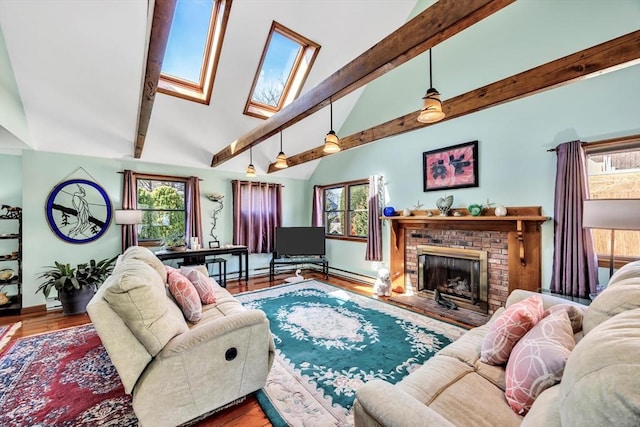67 Whippoorwill Cir, Mashpee, MA 02649 - living room with beam ceiling, a skylight, high vaulted ceiling, a fireplace, and baseboards