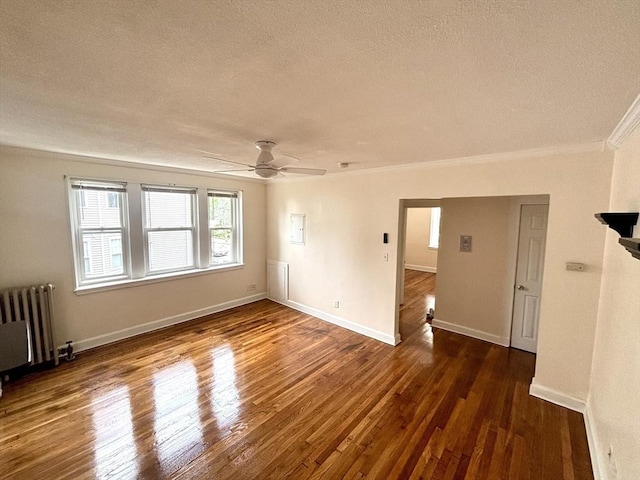 8 Walnut St Unit 8, Everett, MA 02149 - empty room with radiator heating unit, a textured ceiling, crown molding, wood finished floors, and ceiling fan