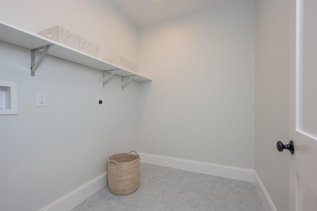 laundry room featuring laundry area, electric dryer hookup, and baseboards