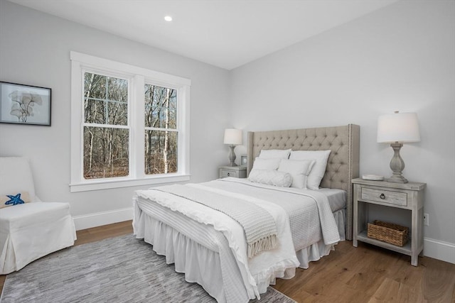 bedroom featuring recessed lighting, wood finished floors, and baseboards