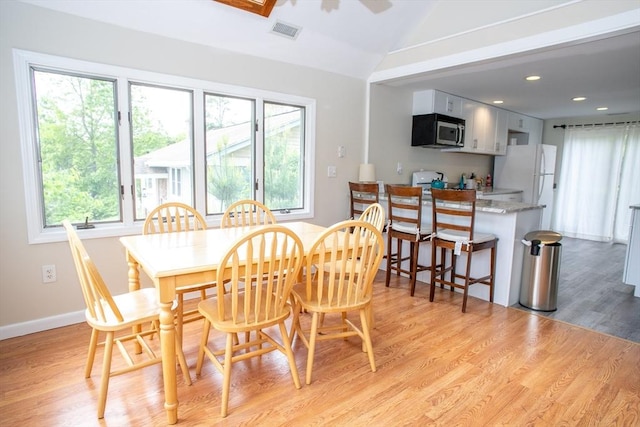 22 Everton Ave, Worcester, MA 01604 - dining area with healthy amount of natural light, vaulted ceiling, light wood-style floors, ceiling fan, and recessed lighting
