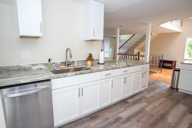 22 Everton Ave, Worcester, MA 01604 - kitchen with stainless steel dishwasher, a sink, wood finished floors, white cabinets, and light stone countertops