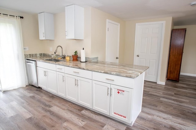 22 Everton Ave, Worcester, MA 01604 - kitchen featuring a sink, dishwasher, light wood-style floors, light stone counters, and white cabinets