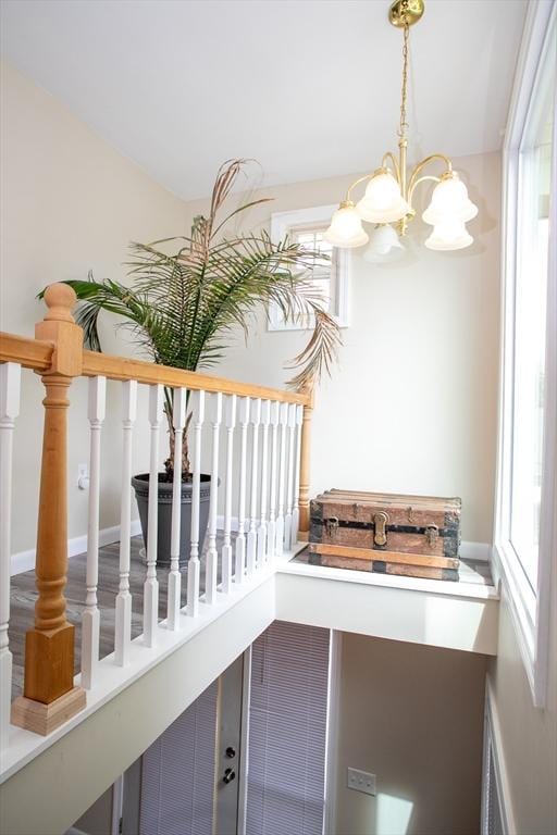 22 Everton Ave, Worcester, MA 01604 - staircase with a chandelier and plenty of natural light
